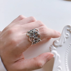 Minimalist 925 sterling silver interlocking ring with vintage matte finish on finger