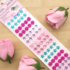 Detailed view of assorted 3D crystal jewel stickers in floral and heart shapes