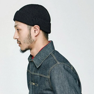 Classic black ribbed knit beanie hat for men and women with stylish folded brim design