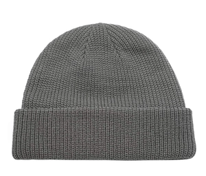 Detailed view of dark grey knitted beanie featuring thick vertical stripe texture