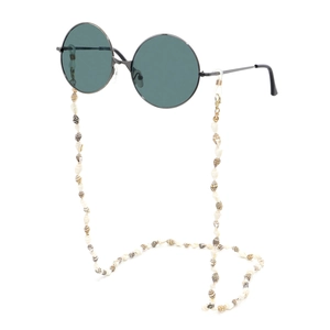 Detail of vintage round sunglasses with green lenses and natural shell beaded lanyard
