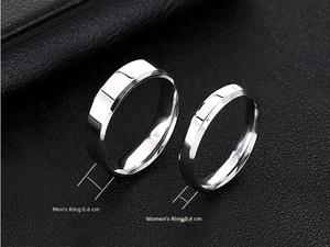 Detail view of 6mm and 4mm polished titanium steel bands for couples in silver