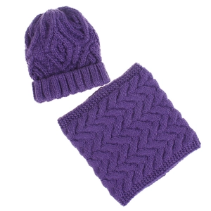 Detail of dark purple chunky knit hat and neck warmer set with classic cable pattern
