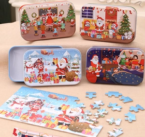 Christmas wooden DIY puzzle in colorful tin boxes featuring Santa Claus and reindeer motifs