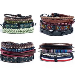 Detail view of 4-piece ethnic multilayer bracelets with wood beads and braided leather