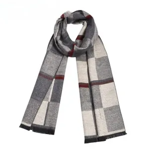 Detailed view of grey and white checkered scarf with red stripes and fringe tassels