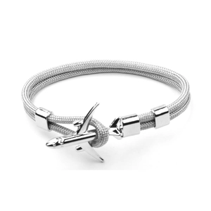 Grey braided polyester rope bracelet featuring a silver airplane charm on white background