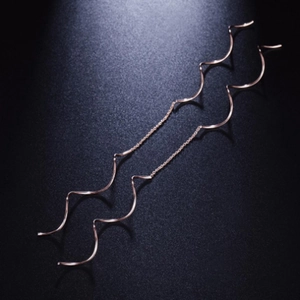 Elegant rose gold S-shaped long tassel drop earrings with a modern wavy spiral threader design