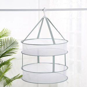 Detail of a double-layer breathable mesh drying basket with rotating hook and gray trim