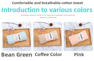 Close-up of soft coral fleece towels in bean green, coffee, and pink with paper wraps