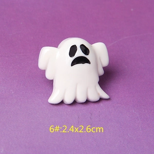 Macro shot of white resin Halloween ghost with spooky face for DIY crafts decoration