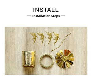 Detailed flat lay of golden rotating candle holder kit with glass cup and fairy charms