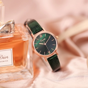Detail of elegant ladies watch with green malachite dial and rose gold accents