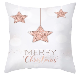Détail de paillettes étoiles or rose et texte Merry Christmas sur taie d'oreiller peau de pêche