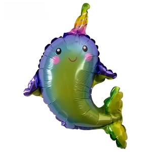 Detail of narwhal foil balloon with gradient rainbow colors and cute cartoon features