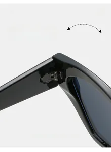 Macro shot of durable metal hinges on geometric black sunglasses with polished finish