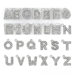 Detail view of 26 pieces silver alphabet A-Z charms set with full clear crystal pave