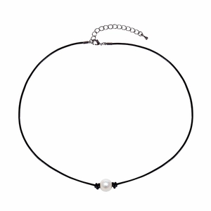 Close-up of natural freshwater pearl necklace with black leather cord and metal clasp