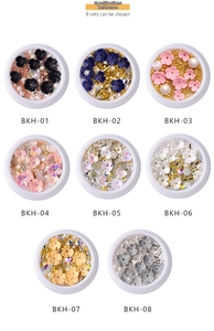 Detailed close-up of 8 sets of 3D shell flower nail charms and mixed metallic beads