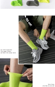 Detail view of ribbed fluorescent green and grey mid-tube crew socks for men