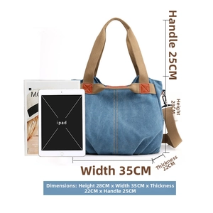 Blue canvas tote bag dimension details 35x28x22cm with brown handles and iPad reference