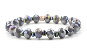 Detail of beaded bracelet with faceted grey crystals and metallic geometric spacer beads