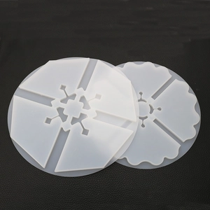 Detail of translucent silicone molds for DIY resin coasters with snowflake and floral patterns
