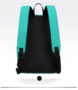 Detail view of the ergonomic black padded shoulder straps on a cyan blue casual backpack