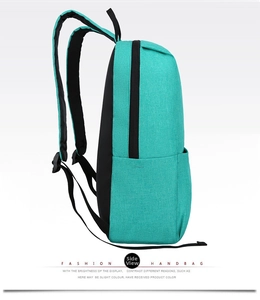 Side view of mint green leisure backpack with black side pocket and durable fabric detail