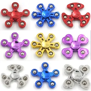 Detailed grid of nine colorful metal-plated fidget spinners in stars and heart shapes