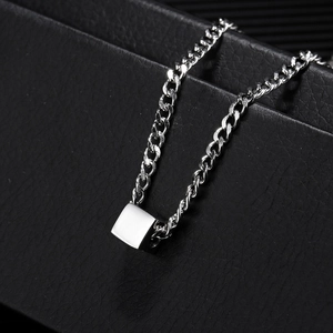 Unisex silver 3D cube pendant necklace with a polished Cuban chain on leather
