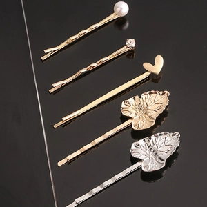 Detailed view of 5-piece minimalist metal hair clip set with pearls and rhinestones