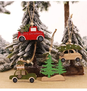Detail of wooden Christmas ornaments featuring red truck and green car with hemp rope