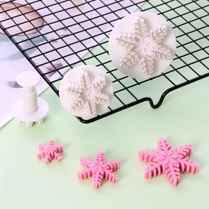 Detailed view of 3pcs snowflake cookie cutters with spring-loaded stamps for DIY baking