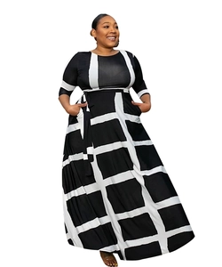 Detail of high-waisted maxi dress featuring bold black and white geometric pattern