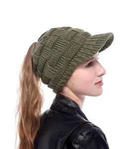 Deep green knit ponytail baseball cap featuring textured chunky weave and back opening