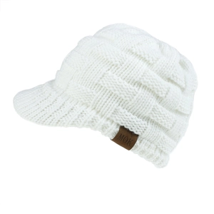 Detail of white basket-weave knit texture and brown leather label on the baseball cap
