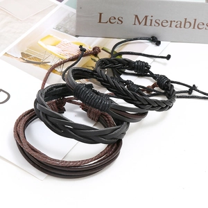 Retro multi-layer braided leather bracelet set in black and brown with adjustable cords