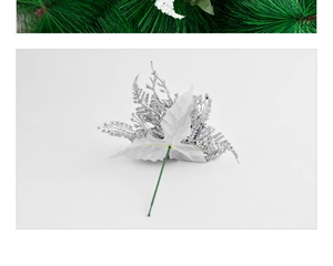 Detail of silver Christmas pick with glitter finish and green spruce needle accents