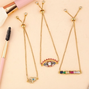 Three-piece gold Hamsa Hand and Evil Eye adjustable bracelets with rainbow cubic zirconia