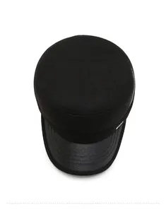 Top view of men's winter flat cap featuring fabric texture and leather-like brim detail