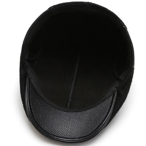 Classic black wool beret cap with premium textured leather brim in a retro newsboy style