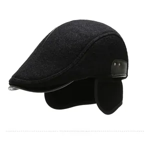 Detail of wool blend peaked cap featuring earflaps and side leather strap with metal rivets