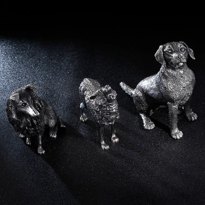 Vintage stainless steel dog and sheep figurines with realistic metallic details