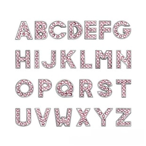 Detail of 26 pink rhinestone alphabet letters A-Z charms for DIY jewelry and bracelets