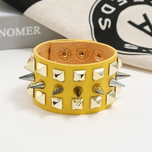 Punk yellow leather bracelet with three rows of spiked metal studs and snap buttons