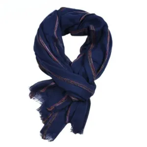 Detailed view of dark blue men's scarf with subtle colorful stripes and frayed edges