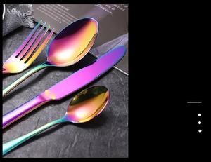 Detailed view of iridescent rainbow stainless steel cutlery set with mirror finish
