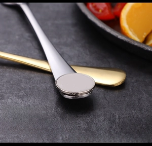 Macro shot of 1010 series thickened stainless steel spoons in gold and silver finish