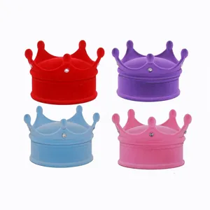 Crown shaped velvet jewelry boxes in red, purple, blue, and pink with rhinestone accents